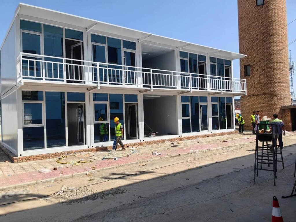 Modern two-story glass facade container office building with meeting rooms and reception area